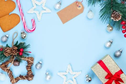 Festive frame with gift box, pine branch, empty shopping tag, stars 写真素材