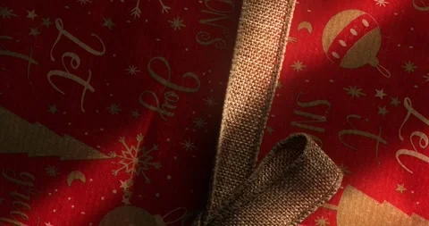 Festive Gift Box with a Burlap Ribbon Bow Stock Footage 295143335