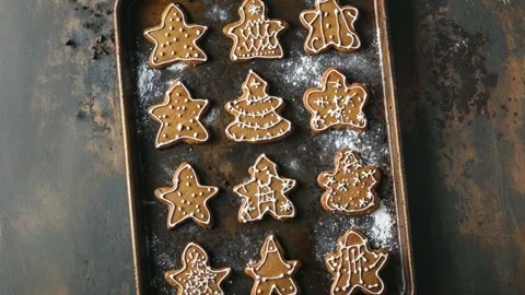 Festive Gingerbread Cookies on Baking Tray with Holiday Spices and Pine Branch Stock Footage 294506458
