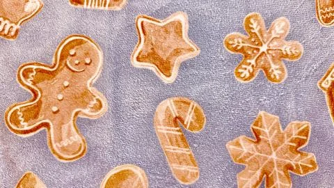 Festive gingerbread holiday cookie pattern on blue texture for web design a.. Stock Photos