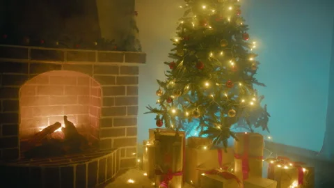 Festive Glowing Christmas Tree With Presents Gift Boxes Under It Stock Footage 322044194