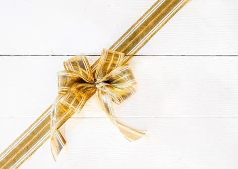 Festive golden bow with copyspace Stock Photos
