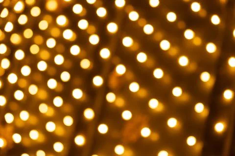 Festive Golden Light Dots Pattern for Holiday Design. Stock Photos