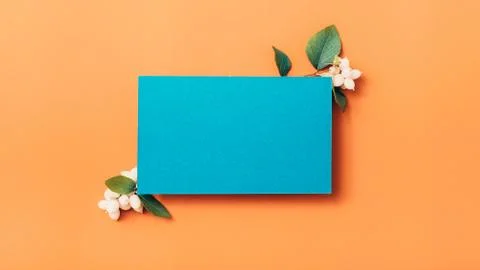 Festive greeting card blue paper orange background Stock Photos
