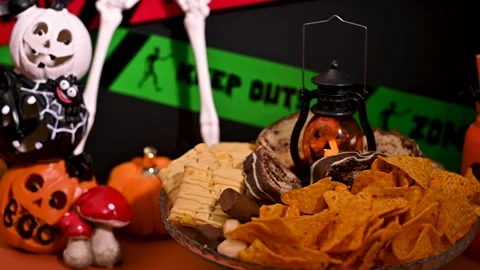 Festive Halloween Dessert Table: Snacks, Sweets, and Decoration Stock Footage 251491932