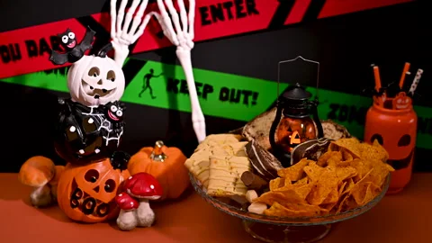 Festive Halloween Dessert Table: Sweets and Pumpkin Decor Stock Footage 251491756