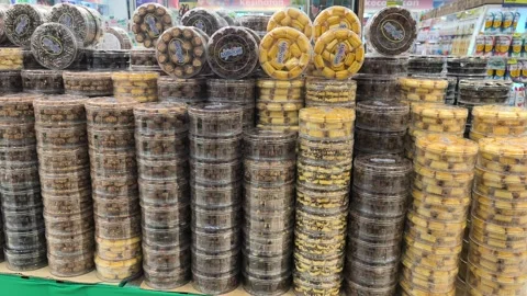 Festive Hari Raya Cookies in Sturdy Jars at a Malaysian Supermarket Stock Footage 334723144