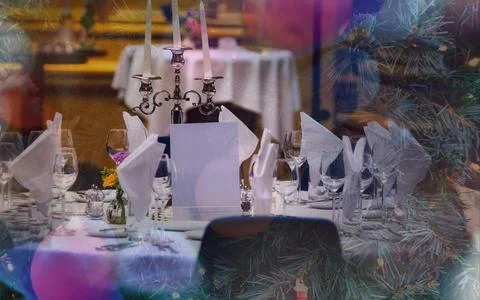 Festive Holiday Dining Table Setting with Christmas Tree Decorations and Ca.. Stock Photos
