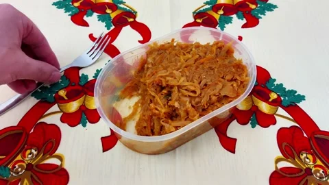 Festive Holiday Stewed Cabbage: Simple Comfort in a Plastic Container Stock-Footage 325423501