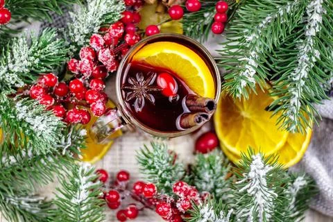 Festive holiday table with drinks and pine decorations Stock Photos