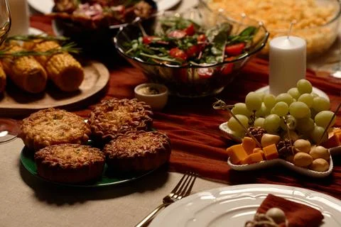 Festive Holiday Table Setting with Mini Pies and Fresh Grapes Stock Photos