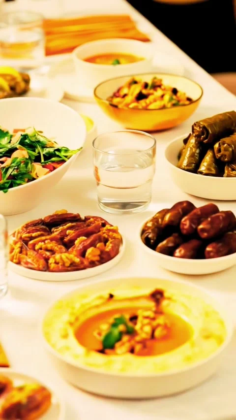 Festive iftar spread with dates, salad and Middle Eastern food Stock Footage 320546417