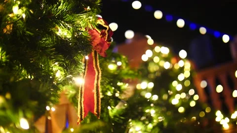 Festive illuminated Christmas tree with decorations and bows Stock Footage 166662956