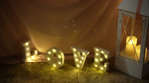 Festive lighting decorations in shape of alphabet letters, word love with neon 库存影片 165345921