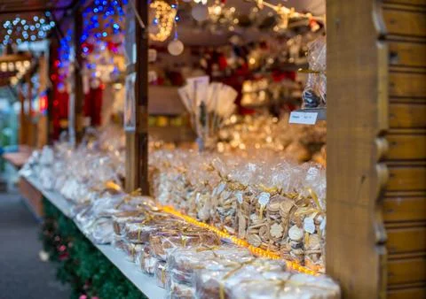 Festive market stall displaying an array of beautifully packaged holiday treats Stock Photos
