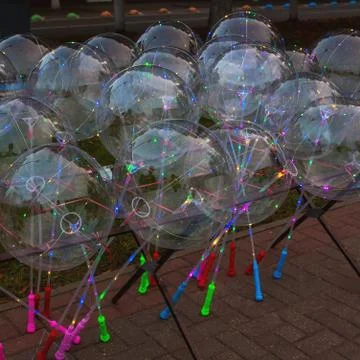 Festive multi-colored glowing led balls Stock Photos