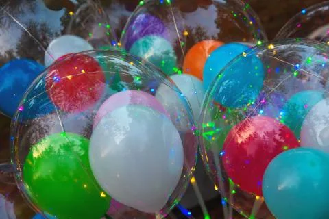 Festive multi-colored glowing led balls Stock Photos
