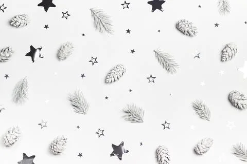 Festive natural texture made of white spruce branches, pine cones and silver  Stock Photos