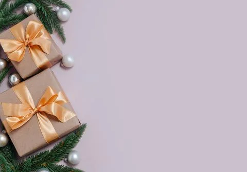Festive New Year backdrop with gift boxes, fir branches, and ornaments, cop.. Stock Photos