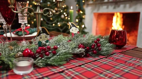 Festive New Year's table on the background of a fireplace with fire Stock Footage 164602490