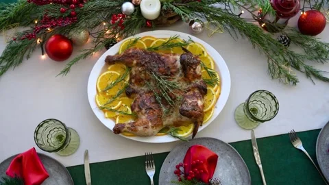 The festive New Year's table is covered with beautiful decorations and there is Stock Footage 292676378