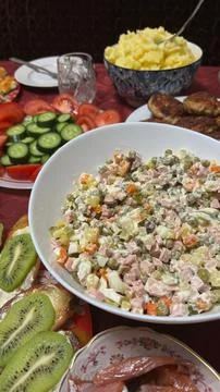 Festive New Years table set with assorted holiday dishes and decorations Stock Photos