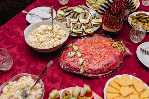 Festive New Years table set with assorted holiday dishes and decorations Stock Photos