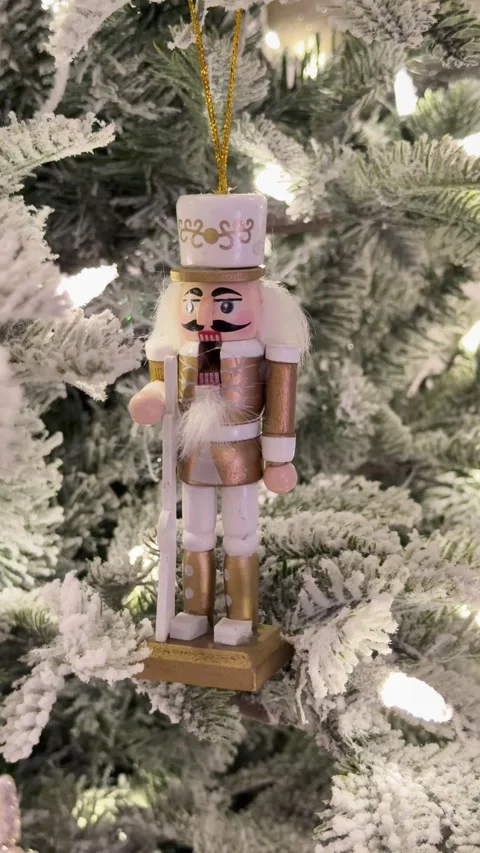 Festive Nutcracker Decor Sparkles on Snowy Christmas Tree 스톡 동영상 328892859