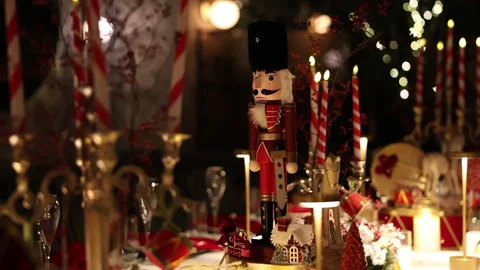 Festive Nutcracker Displayed Elegantly, Ornate Nutcracker With Glowing Candle Stock Footage 323948087