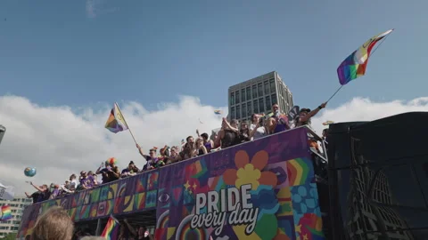 A festive open-top double-decker parade bus with Pride Every Day branding Stock-Footage 346240566