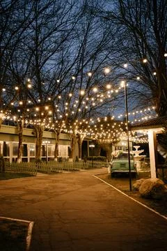 Festive Outdoor Evening with String Lights and Decor Stock Photos