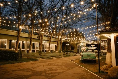 Festive Outdoor Evening with String Lights and Decor Stock Photos