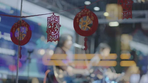 Festive paper-cuts on the windows of Beijing night bars Stock Footage 150205755
