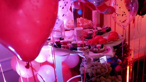 Festive party table with sweets and fruits and ornamentation decorations  Видео 305595107