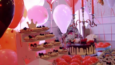Festive party table with sweets cake pastries and ornamentation decorations  Stock Footage 305595239