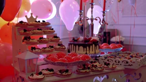 Festive party table with sweets cake pastries and ornamentation decorations  Stock Footage 305595247