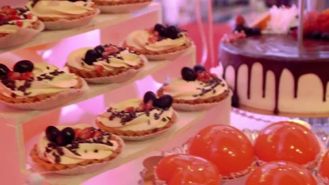 Festive party table with sweets. Holiday and celebratory gala food  Stock Footage 305595037
