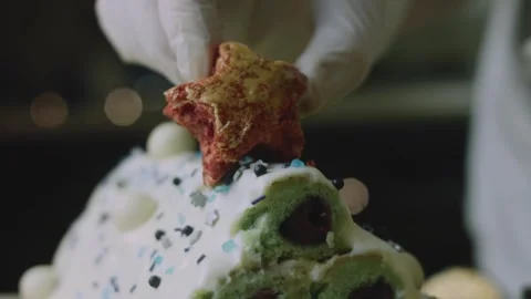 Festive pastry star positioned at the cake peak Stock Footage 342129514