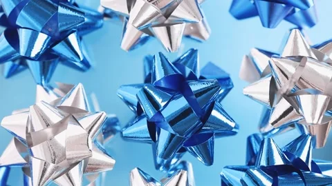 Festive pattern of blue and silver bows rotating, top view. Stock Footage 170699550
