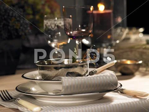 A Festive Place Setting With A Silver Bowl