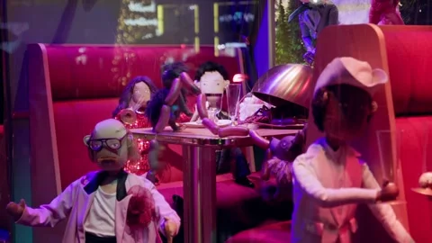 Festive puppet characters in a vibrant Christmas boutique setting in Paris at Stock Footage 295331805