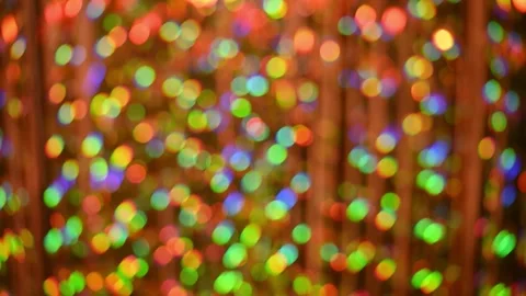 Festive rainbow reflections sparkle in multicolor bokeh background, creating Stock Footage 344548572