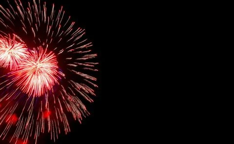Festive red fireworks on background black sky, copy space. Stock Illustration