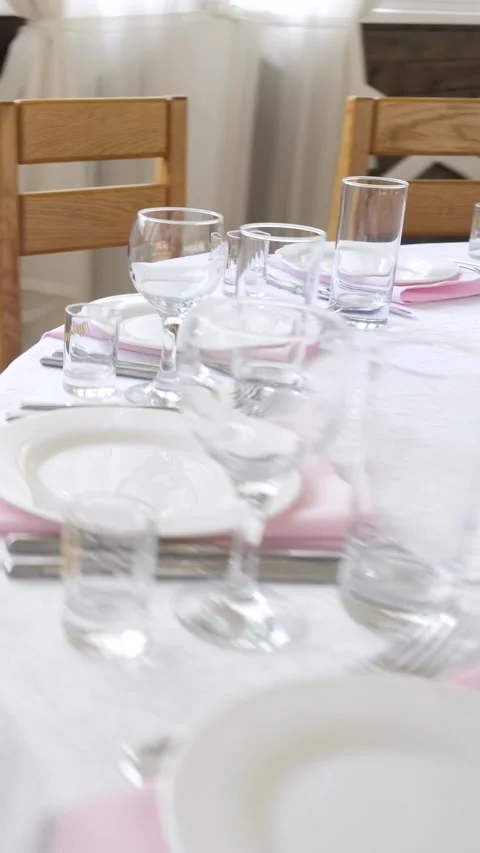 Festive restaurant table setting with elegant pink napkins Stock Footage 335522686