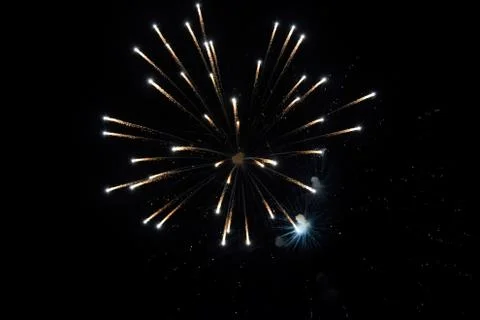 Festive salute in night sky. Explosions of fireworks and pyrotechnics in the  Stock Photos