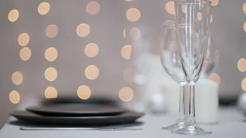 Festive served dining table. Beautiful dishes, tablecloths, wine glasses and Stock Footage 159981370