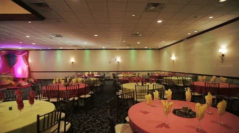 Festive served round dinner tables stand in the restaurant Stock Footage 68684121