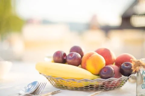 Festive serving table on the beach in sunny day. Preparing for an open-air pa Stock Photos