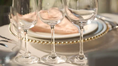 Festive serving of the table with glasses and plates Stock Footage 150747011