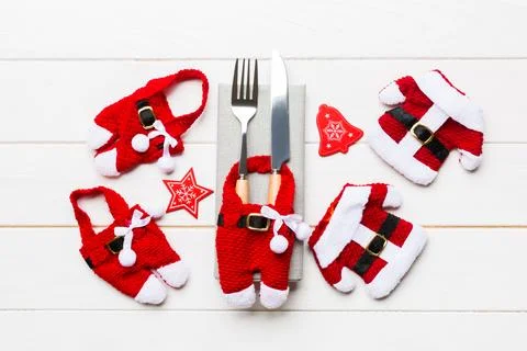 Festive set of fork and knife on wooden background. Top view of new year de.. Stock Photos